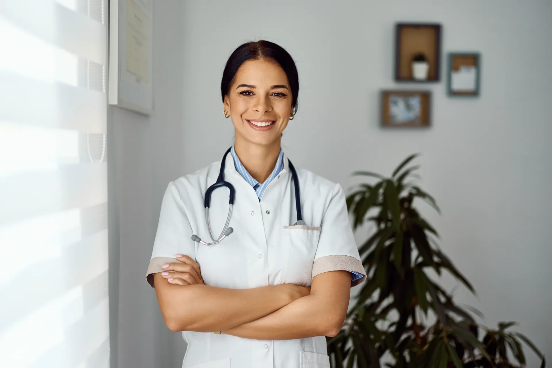 confident female doctor smiling in a modern office utc