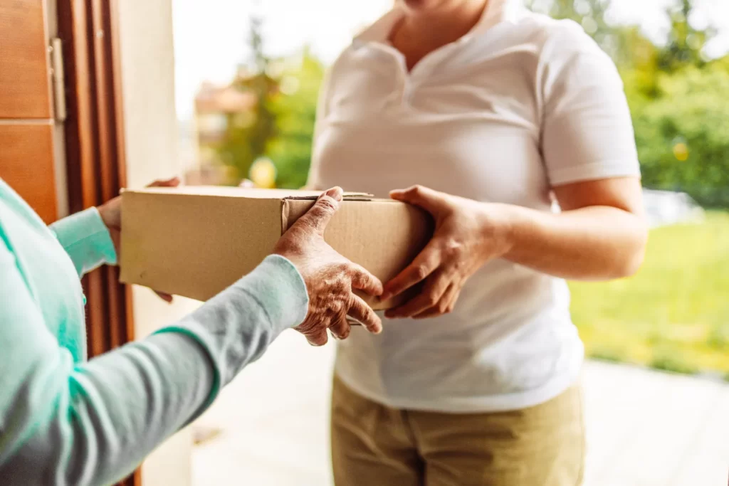 delivery staff carrying paper boxes shop online a utc